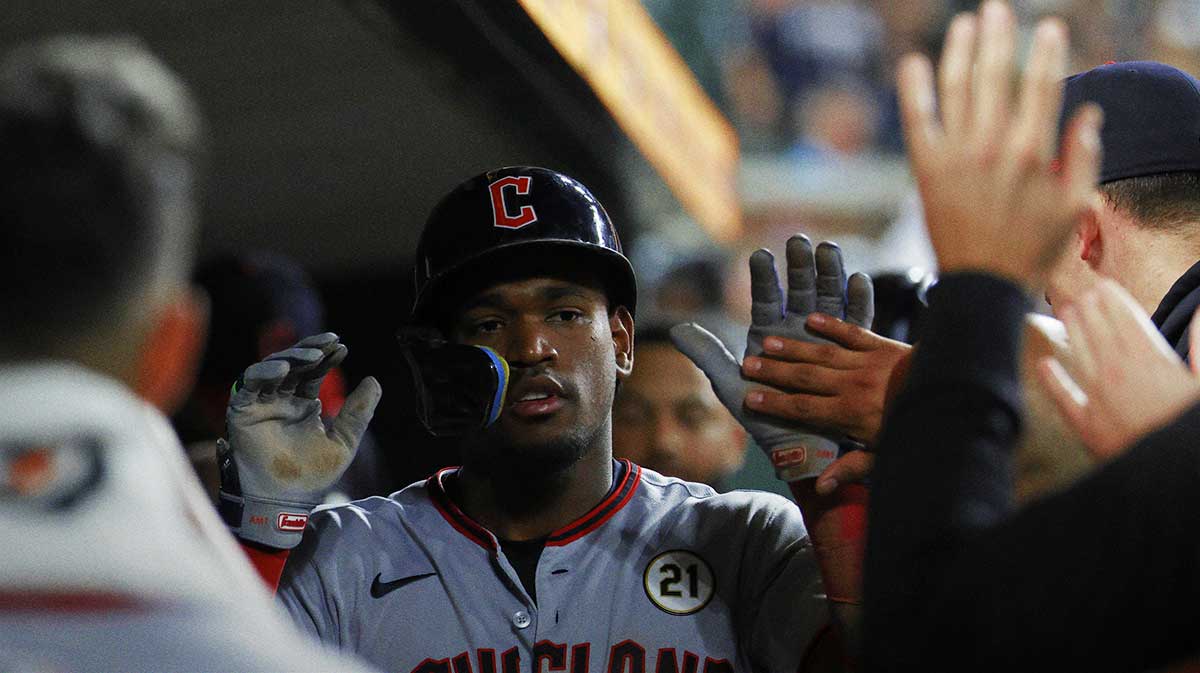 Cleveland Guardians outfielder Angel Martínez (1) is congratulated by teammates after scoring a run in the tenth inning against the Detroit Tigers at Comerica Park. 