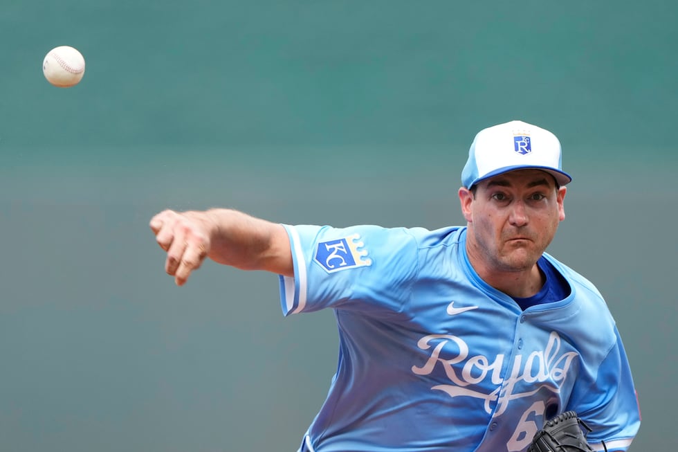 Kansas City Royals starting pitcher Seth Lugo throws during the first inning of a baseball...