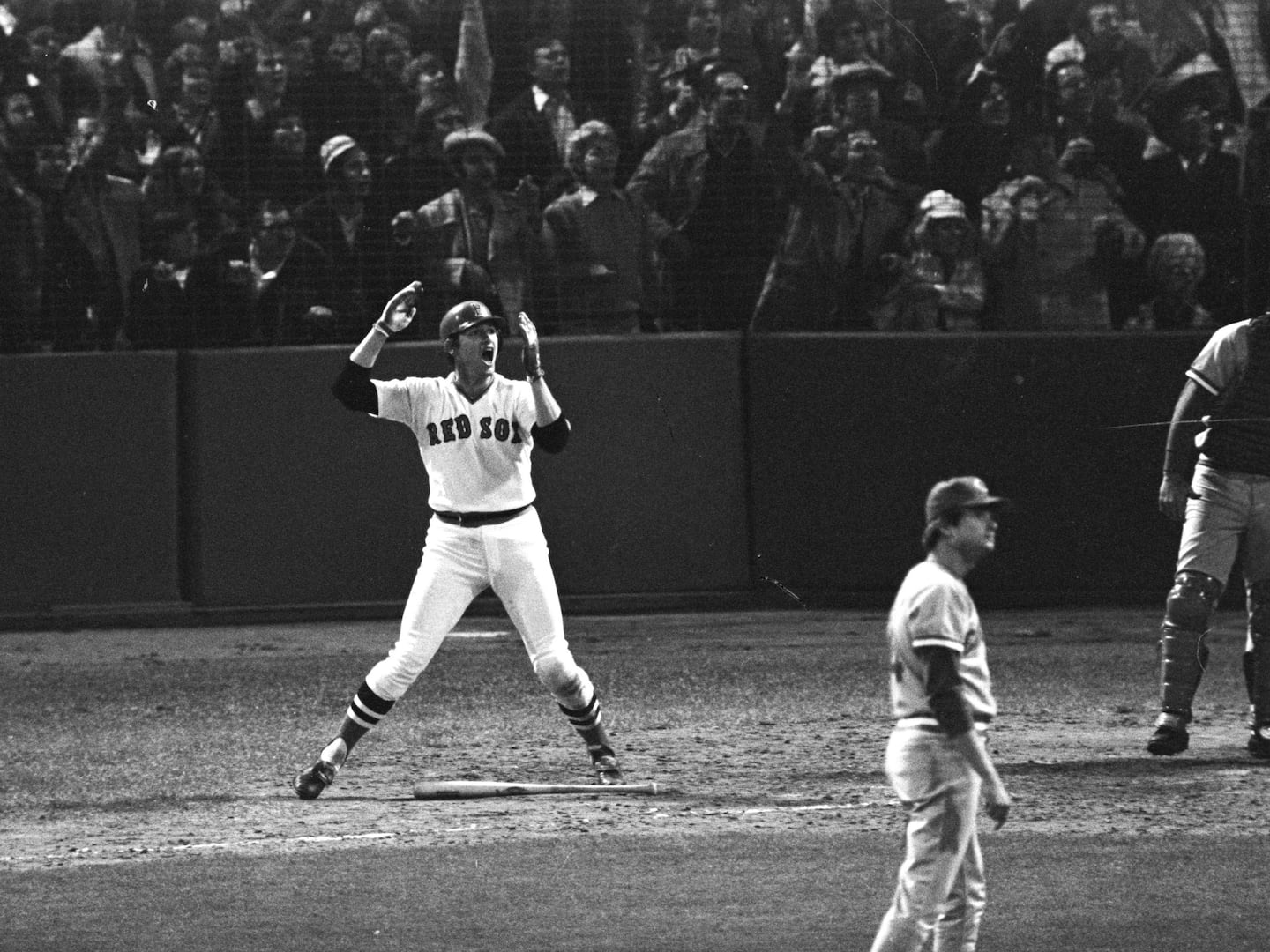 Red Sox catcher Carlton Fisk willed the ball fair for a walk-off home run in the 12th inning of Game 6.