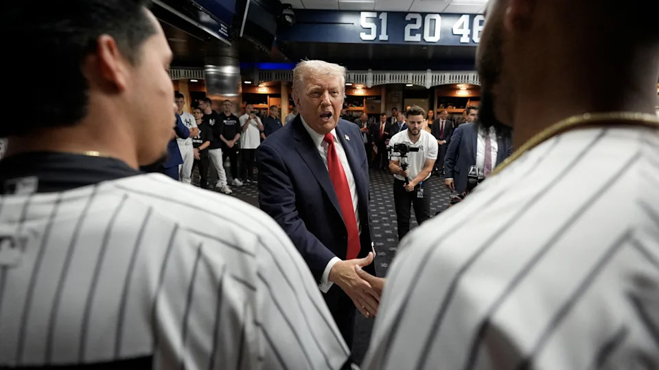 President Donald Trump paid the Yankees a visit in their locker room ahead of the match. / Alex Brandon/Getty Images