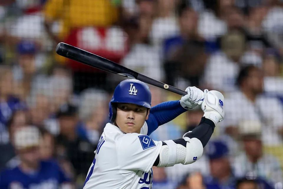 Dodgers designated hitter Shohei Ohtani warms up during the sixth inning of Wednesday's game against the Colorado Rockies.