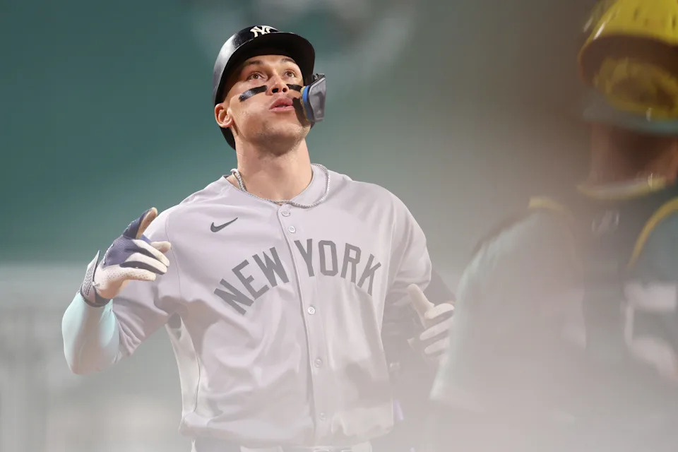Sep 12, 2025; Boston, Massachusetts, USA; New York Yankees designated hitter Aaron Judge (99) reacts after hitting a home run during the first inning against the Boston Red Sox at Fenway Park. Mandatory Credit: Paul Rutherford-Imagn Images
