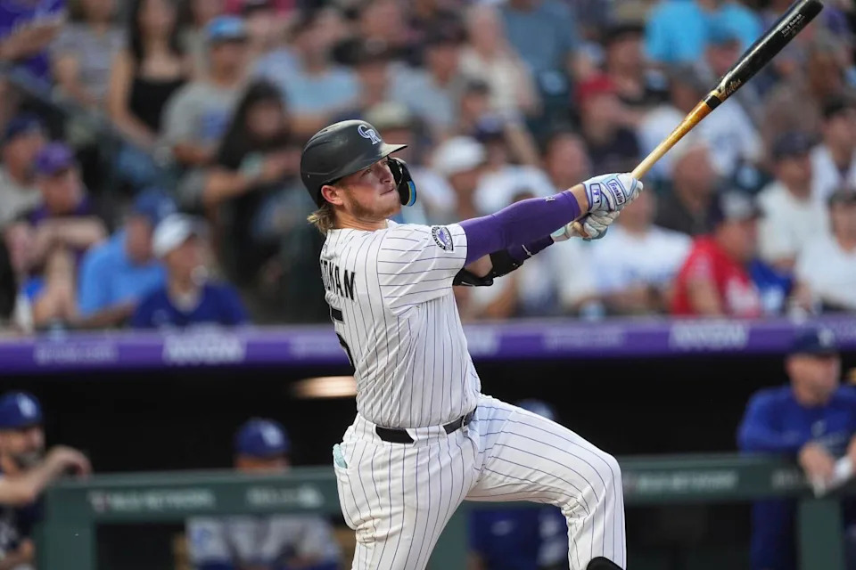 Colorado Rockies catcher Hunter Goodman swings during a game on Aug. 19 against the Dodgers.