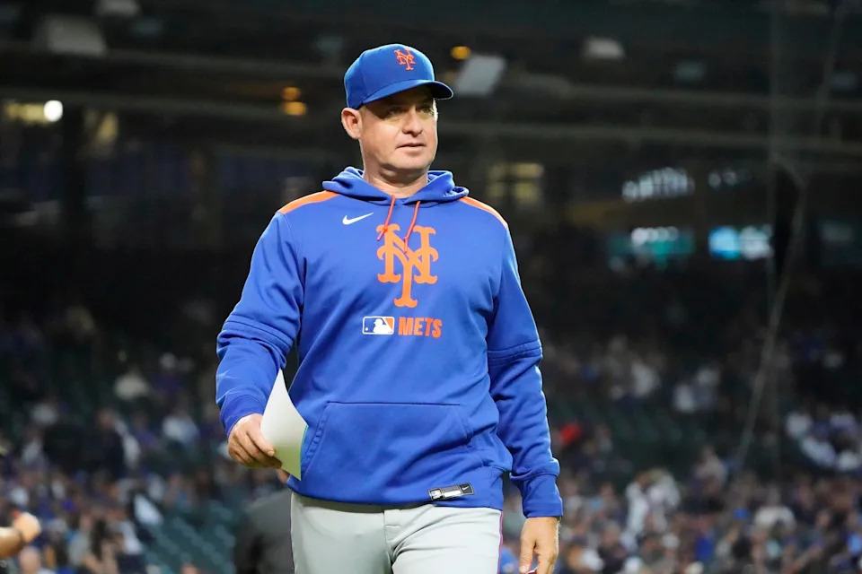New York Mets manager Carlos Mendoza (64) on the field before a game against the Chicago Cubs on Sept. 23, 2025, at Wrigley Field.