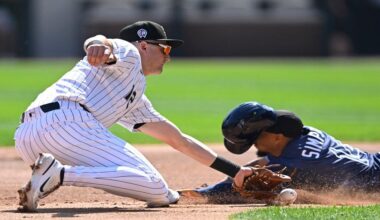 Tampa Bay Rays' Chandler Simpson, right, steals second base as Chicago White Sox shortstop Colson Montgomery, left, attempts to apply the tag during the first inning of a baseball game Thursday, Sept. 11, 2025, in Chicago. (AP Photo/Paul Beaty)