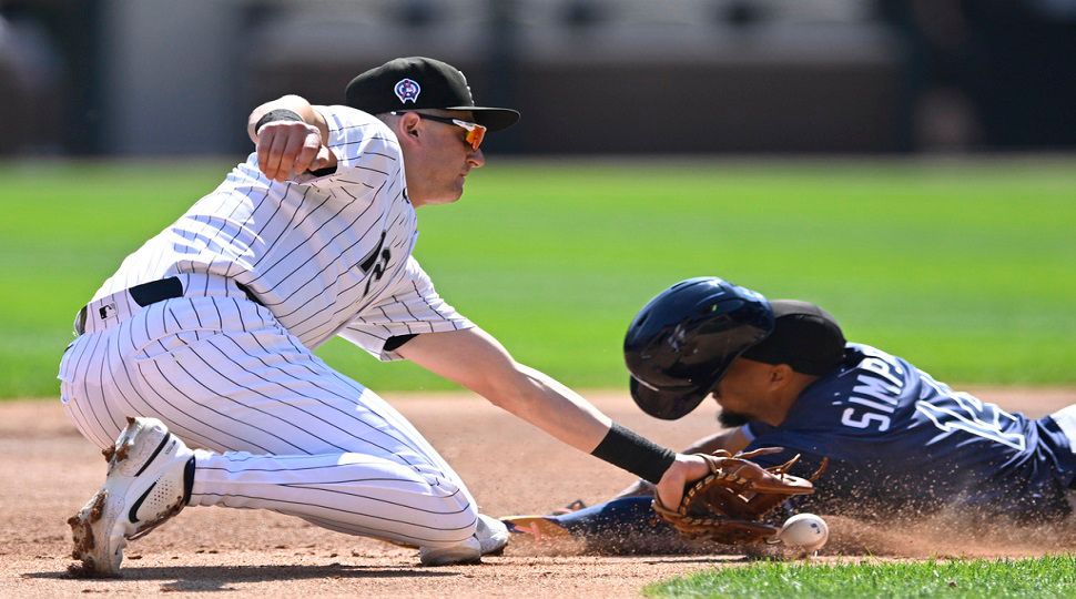 Tampa Bay Rays' Chandler Simpson, right, steals second base as Chicago White Sox shortstop Colson Montgomery, left, attempts to apply the tag during the first inning of a baseball game Thursday, Sept. 11, 2025, in Chicago. (AP Photo/Paul Beaty)