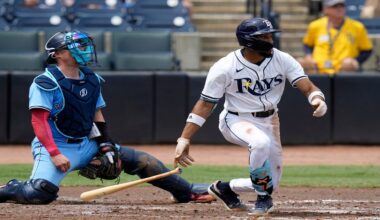 Tampa Bay Rays' Chandler Simpson, right, watches his two-run single off Toronto Blue Jays pitcher Chris Bassitt during the second inning of a baseball game Thursday, Sept. 18, 2025, in Tampa, Fla. Catching for the Blue Jays is Tyler Heineman. (AP Photo/Chris O'Meara)