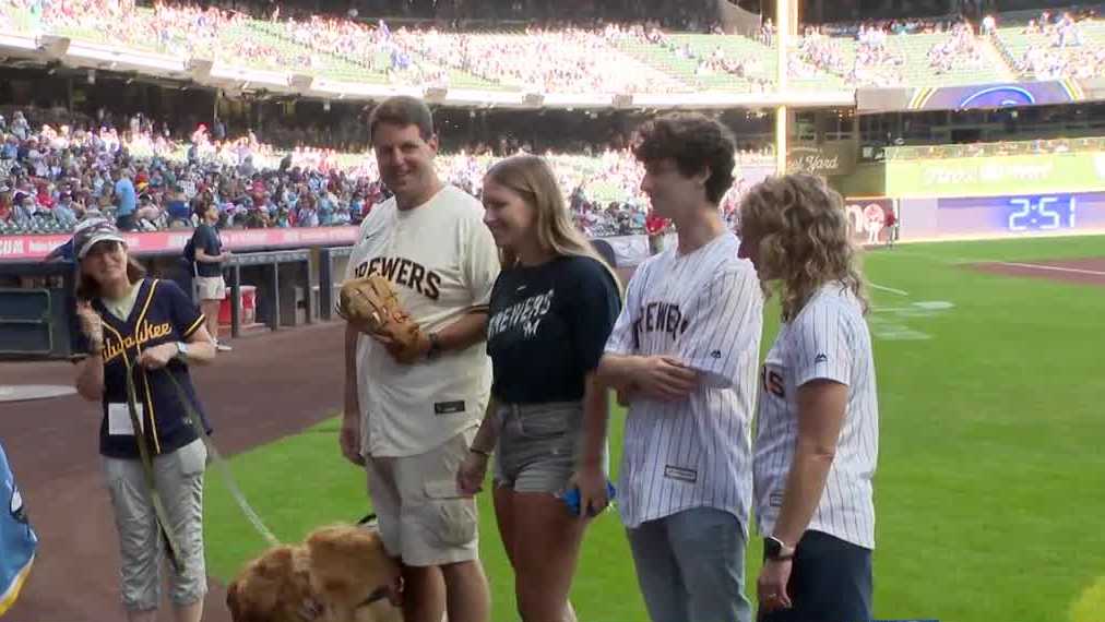 Brewers surprise first responder with service dog