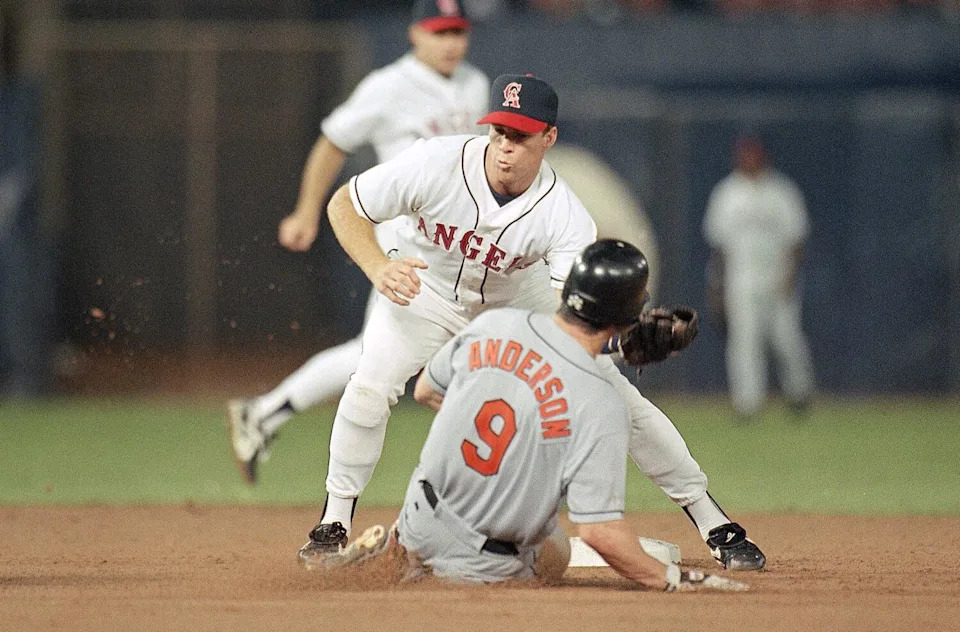 Rex Hudler of the California Angels tags out Brady Anderson of the Baltimore Orioles.