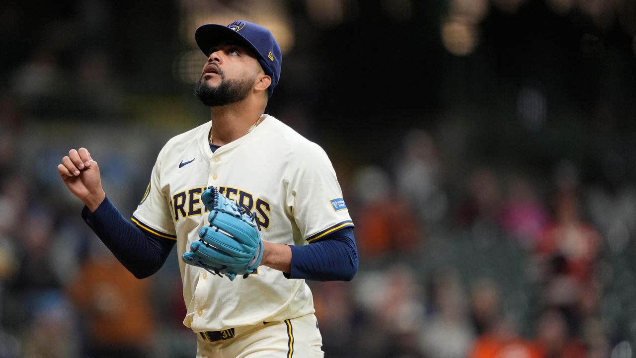 Milwaukee Brewers' Joel Payamps gestures as he walks to the dugout during the seventh inning of a baseball game against the Baltimore Orioles, Tuesday, May 20, 2025, in Milwaukee. (AP Photo/Aaron Gash)