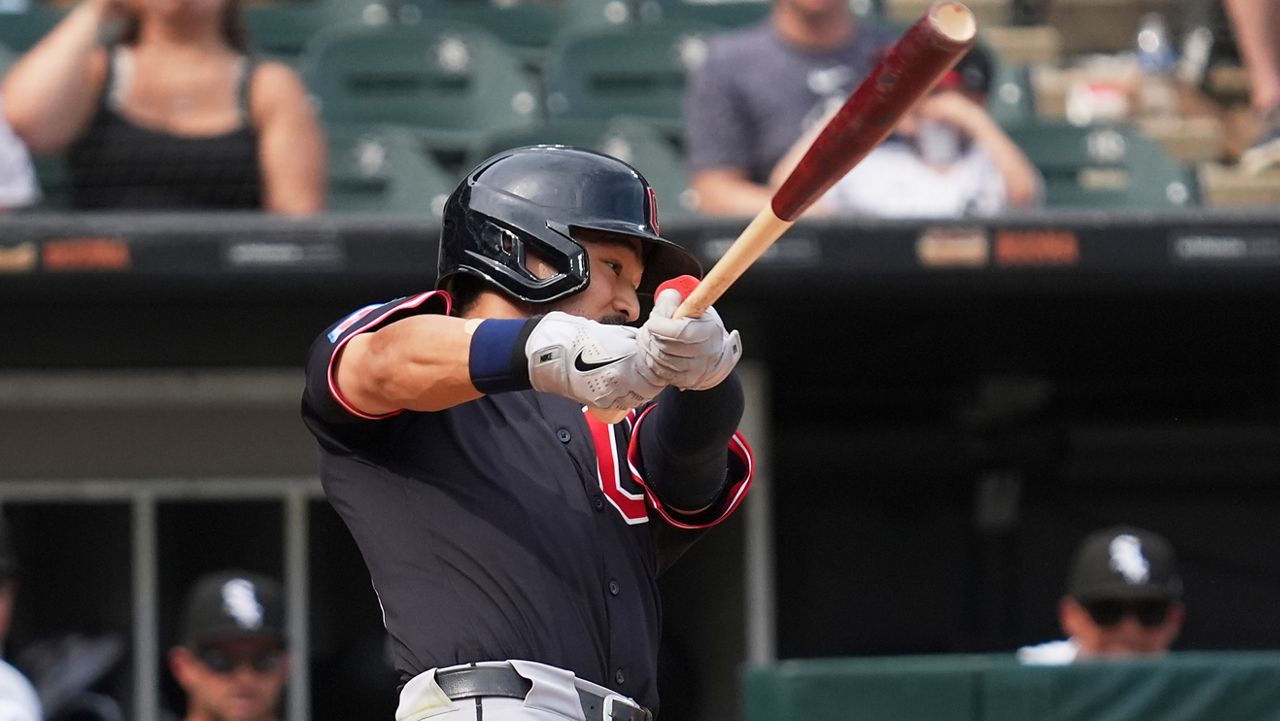 Cleveland Guardians' Steven Kwan hits a sacrifice fly during the 10th inning of a baseball game against the Chicago White Sox in Chicago, Sunday, July 13, 2025. (AP Photo/Nam Y. Huh)