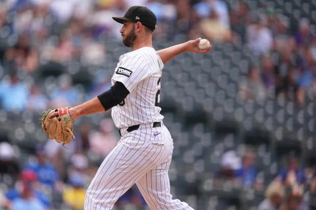 Colorado Rockies catcher Austin Nola, filling in as a relief pitcher in the ninth inning, works against the Toronto Blue Jays in a baseball game Wednesday, Aug. 6, 2025, in Denver. (AP Photo/David Zalubowski)