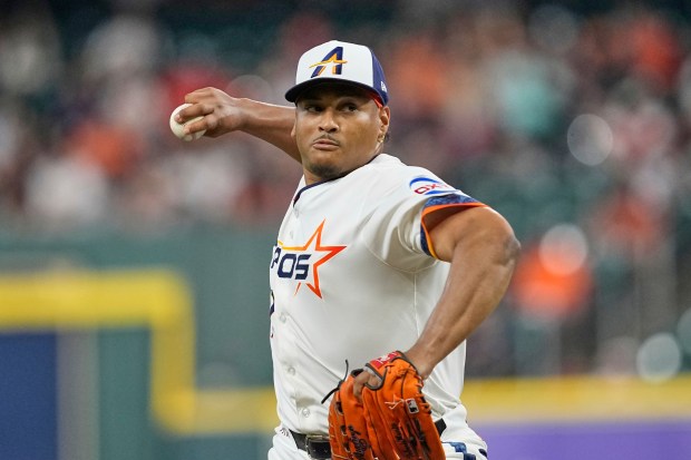 Houston Astros starting pitcher Luis Garcia throws to the plate...