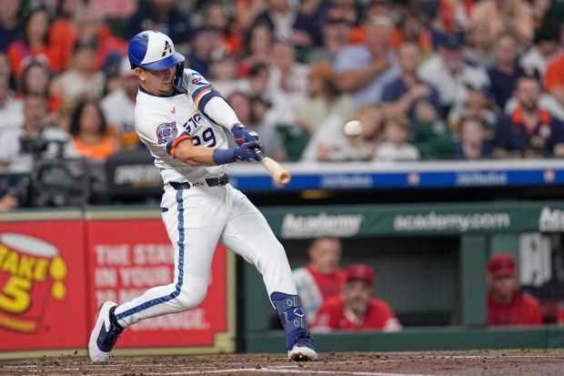 The Houston Astros’ Ramón Urías hits a home run during...