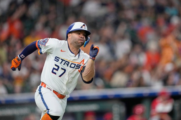The Houston Astros’ Jose Altuve runs up the first base...