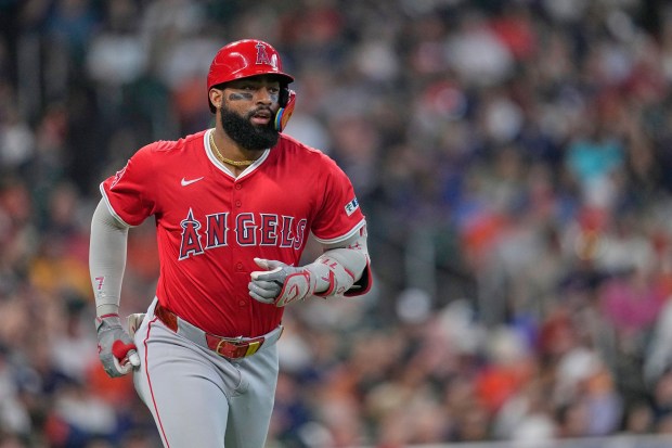 The Angels’ Jo Adell begins to jog around the bases...