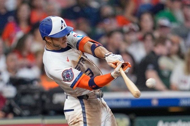 The Houston Astros’ Jeremy Peña hits an RBI double during...