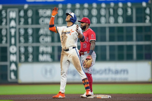 The Houston Astros’ Jeremy Peña (3) celebrates at second base...