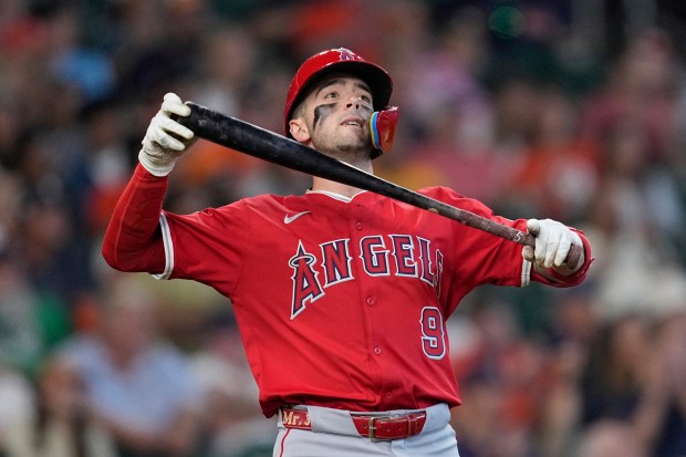 The Angels’ Zach Neto reacts after hitting a line out...