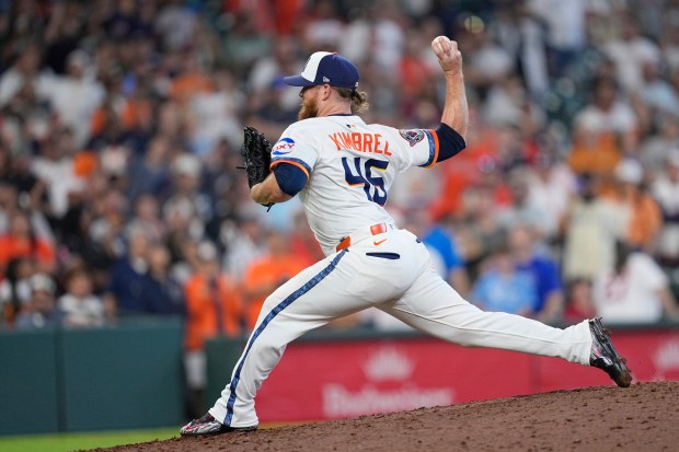 Houston Astros relief pitcher Craig Kimbrel throws to the plate...