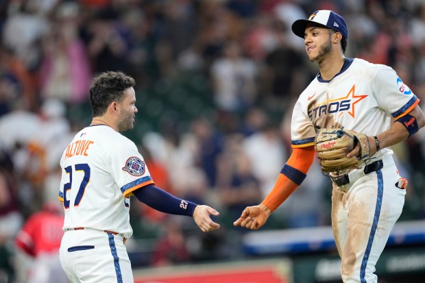 The Houston Astros’ Jose Altuve, left, and Jeremy Peña celebrate...