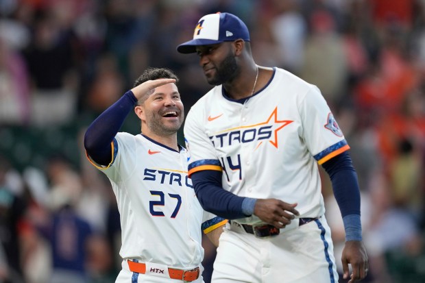 The Houston Astros’ Jose Altuve, left, and Yordan Alvarez celebrate...