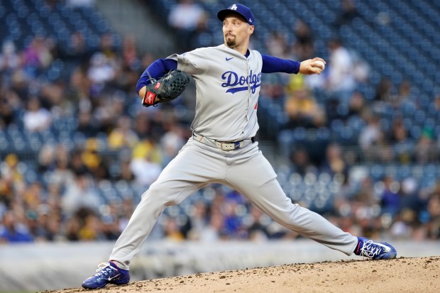 Dodgers starting pitcher Blake Snell throws to the plate during...