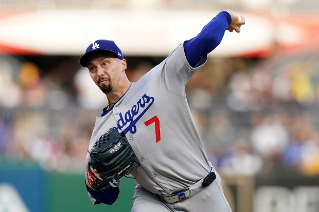 Dodgers starting pitcher Blake Snell throws to the plate during...