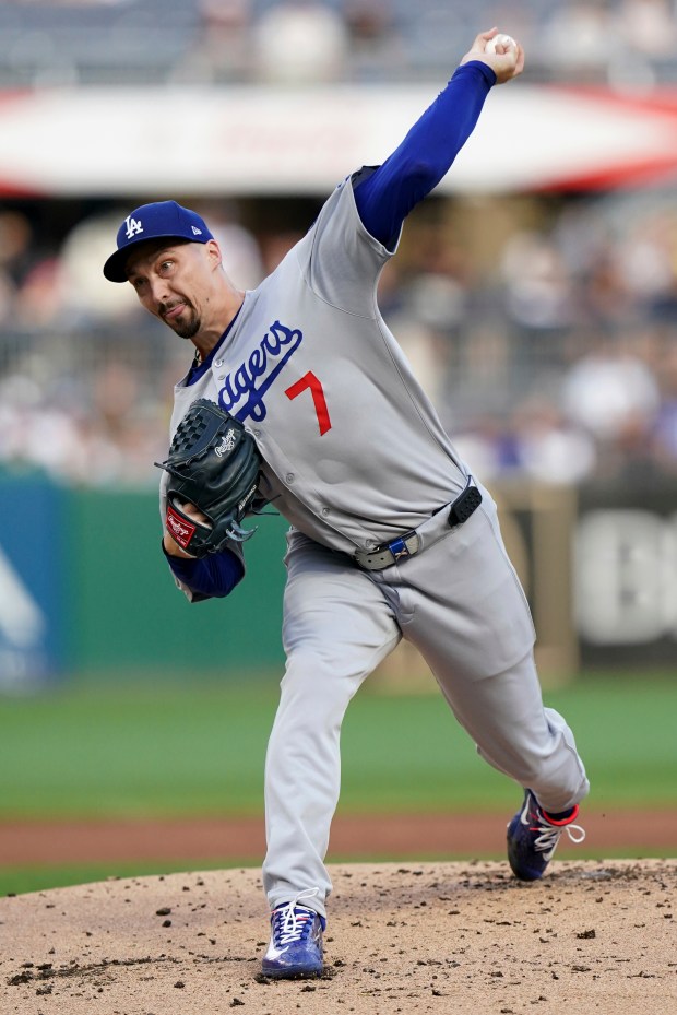 Dodgers starting pitcher Blake Snell throws to the plate during...