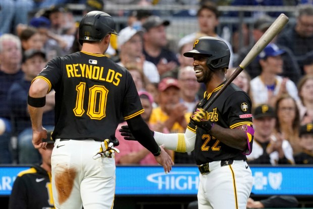 The Pittsburgh Pirates’ Bryan Reynolds, left, is greeted by Andrew...