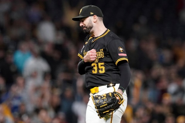 Pittsburgh Pirates relief pitcher Colin Holderman celebrates after getting the...