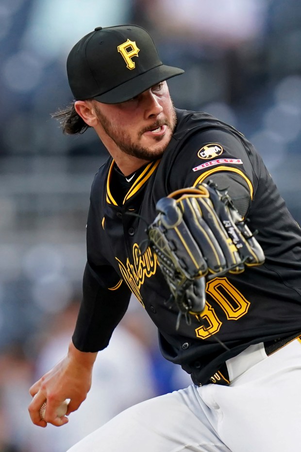 Pittsburgh Pirates pitcher Paul Skenes delivers during the first inning...