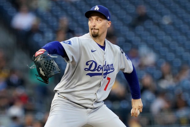 Dodgers starting pitcher Blake Snell throws to the plate during...