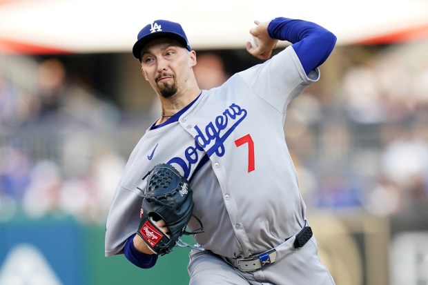 Dodgers starting pitcher Blake Snell throws to the plate during...
