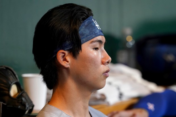 Dodgers utility man Hyeseong Kim sits in the dugout during...