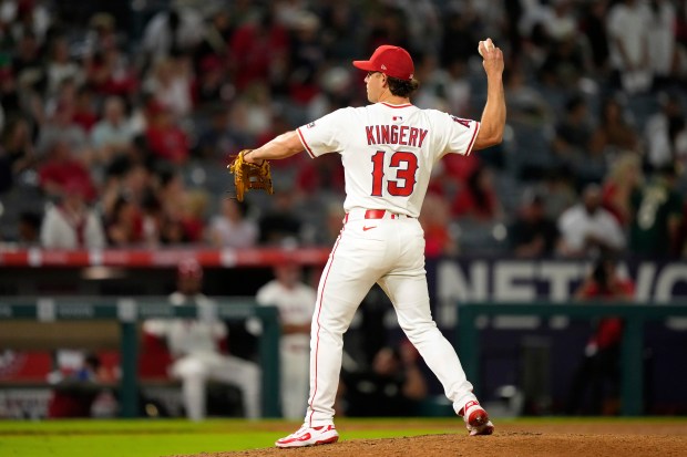 Angels position player Scott Kingery pitches during the ninth inning...