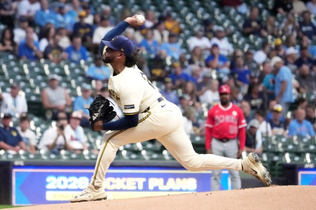 Milwaukee Brewers starting pitcher Freddy Peralta throws to the plate...