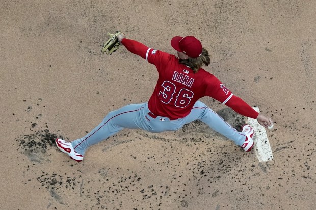 Angels starting pitcher Caden Dana throws to the plate during...