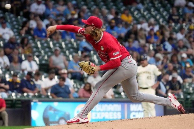 Angels starting pitcher Caden Dana throws to the plate during...