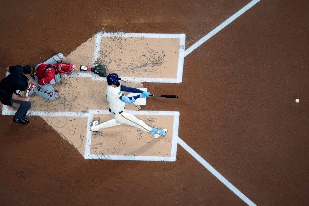 The Milwaukee Brewers’ Christian Yelich hits an RBI double during...
