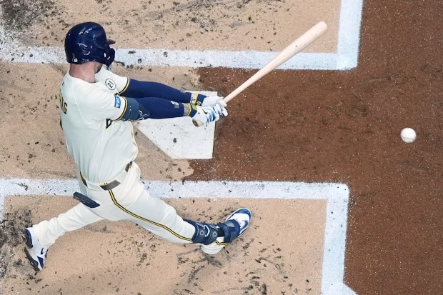 The Milwaukee Brewers’ Brice Turang hits a double during the...