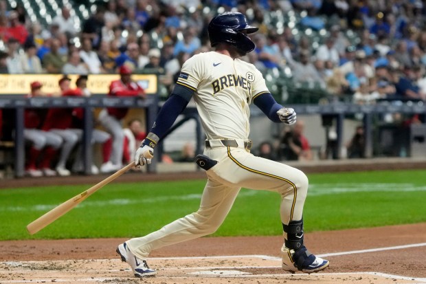 The Milwaukee Brewers’ Brice Turang hits a double during the...