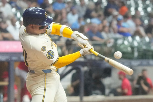 The Milwaukee Brewers’ William Contreras hits a single during the...
