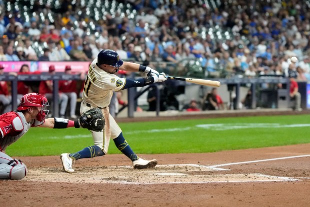 The Milwaukee Brewers’ Caleb Durbin hits an RBI single during...