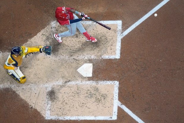 The Angels’ Denzer Guzman hits a solo home run during...