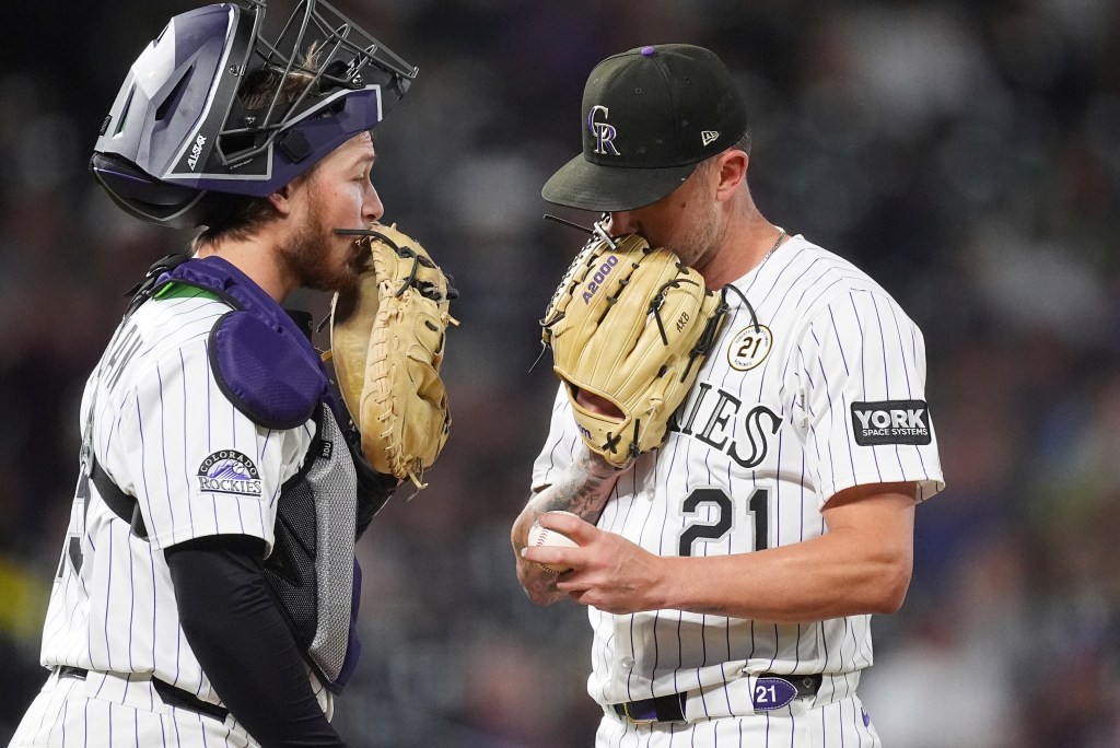 Rockies' late rally falls short in 6-5 loss to Marlins at rainy Coors Field