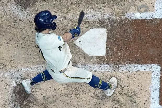 The Milwaukee Brewers’ Sal Frelick hits a double during the...