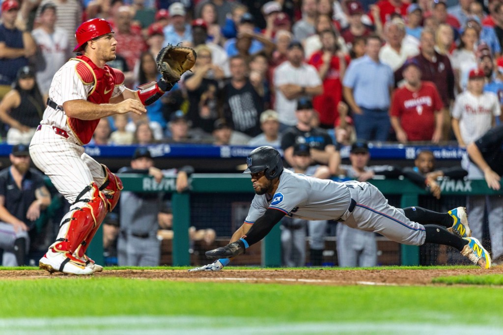 Phillies lose to Marlins in 11, hope not to lose J.T. Realmuto to injury