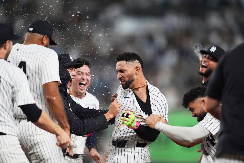 Yankees celebrate postseason berth with walk-off win, continue AL East chase