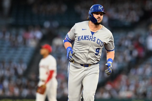 The Kansas City Royals’ Vinnie Pasquantino runs the bases after...